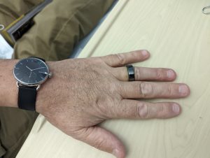 Photograph of Thomas Westworth wearing the smart ring and watch