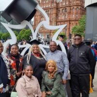 Group photo of Gloria with her family