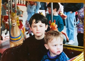 Photo of Sean and Joe as children on a ferris wheel