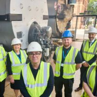 Left to right – Jonathan Kershaw, Kathy Cowell OBE, Andy Burnham, Joshua Leibrick (apprentice) Mark Foden (Associate Director of Sustainability) Sam Heneghan (apprentice)