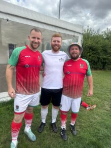 Three men in football kit