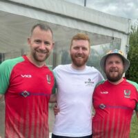 Three men in football kit