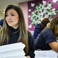 Emmie delivering takeaway meals at RMCH
