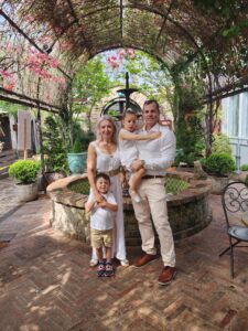 Family group photo of Ava with her mum, dad and brother