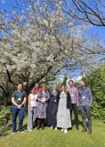 Group of people stood outside.