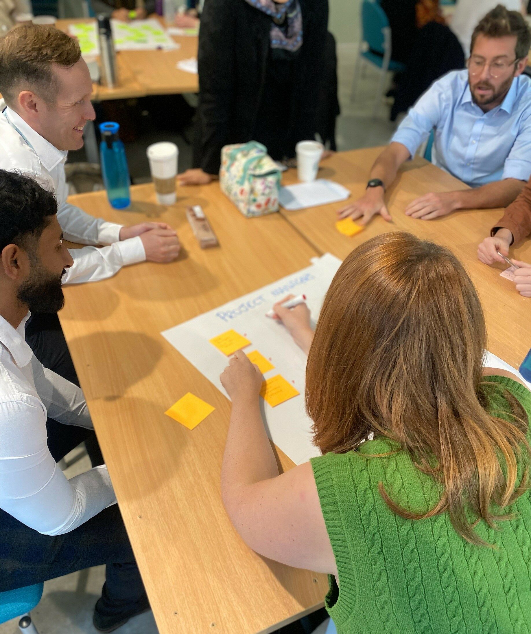 A group of people working around a table