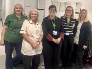 Group of pharmacists stood together.