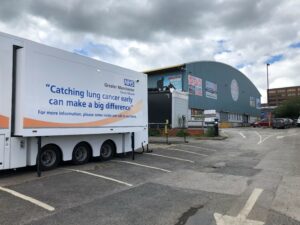 Greater Manchester Lung Cancer Screening mobile clinic parked in car park.