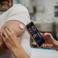 Person using wearable health technology.