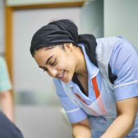 Staff member working with patient.