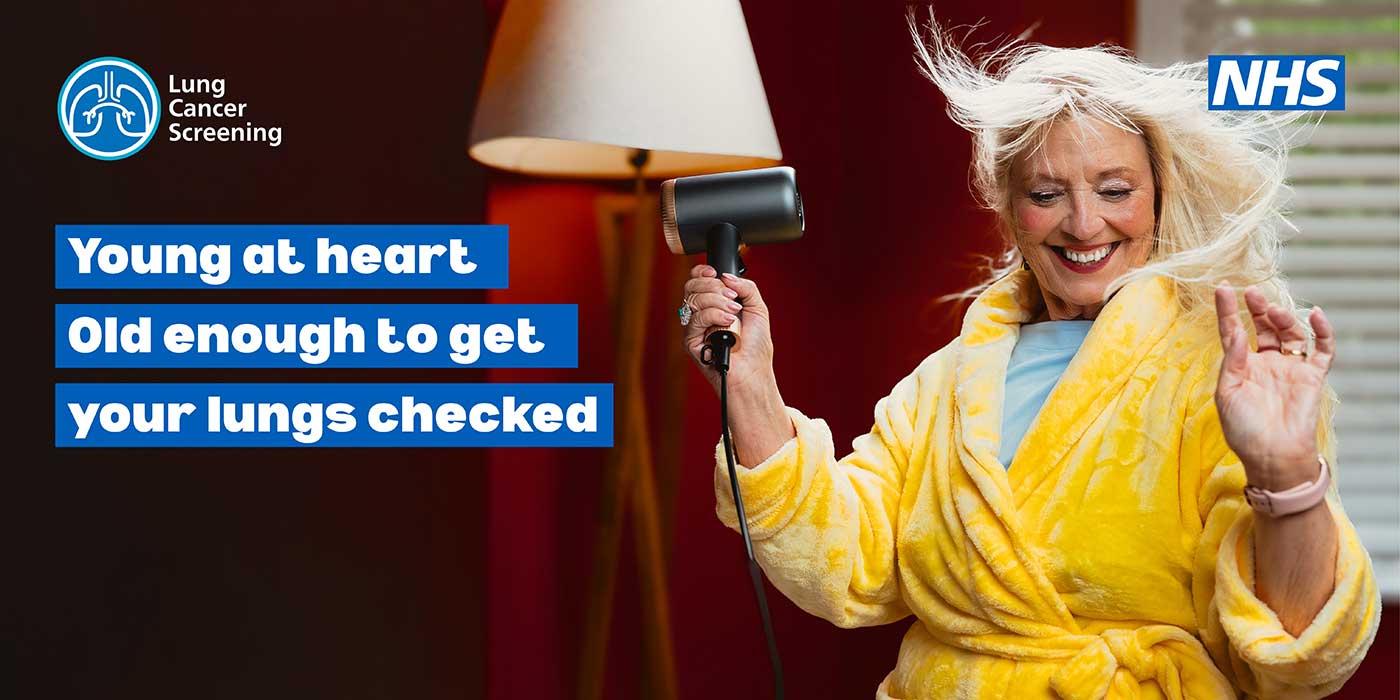 hair-advert Older lady in yellow dressing gown drying her hair. Tagline says: Young at heart, old enough to get your lungs checked.
