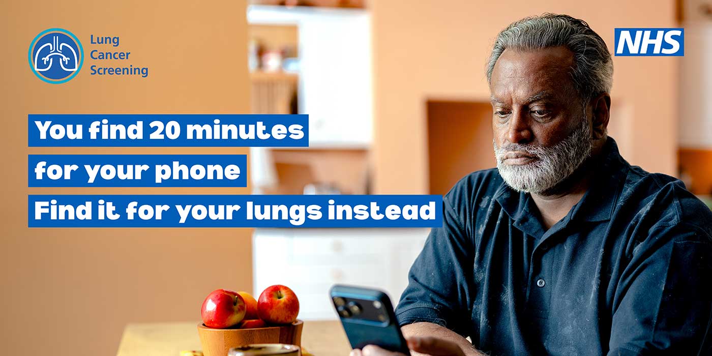 phone-advert Older asian man looking at his phone whilst sat at a kitchen table. Tagline says: You find 20 mins for your phone, find it for your lungs instead.