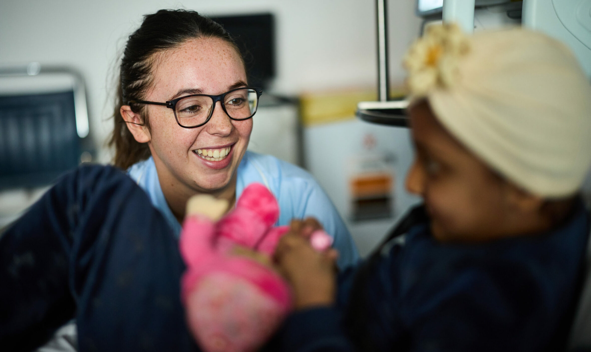 Nurse smiling at a patient.