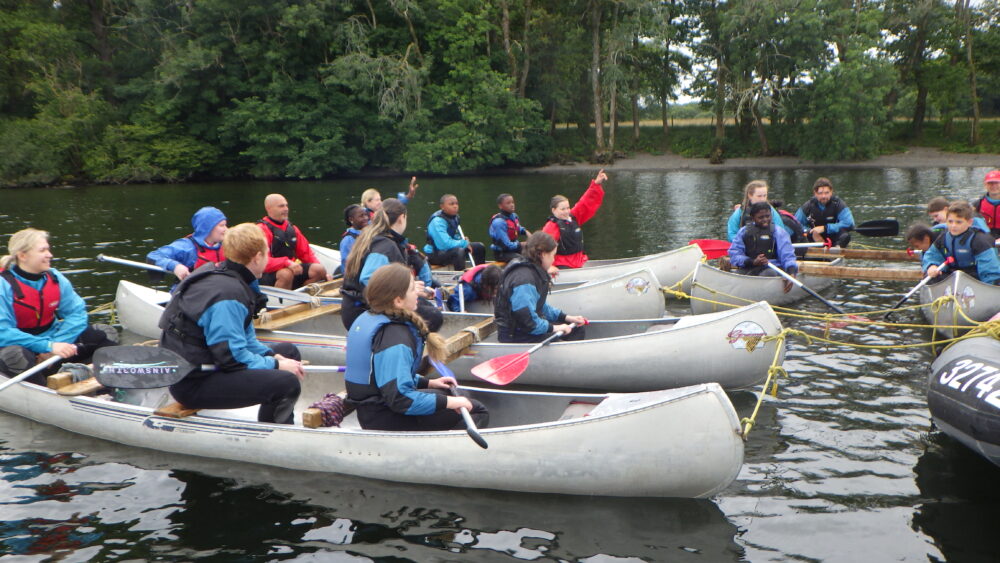 Image of children in canoes